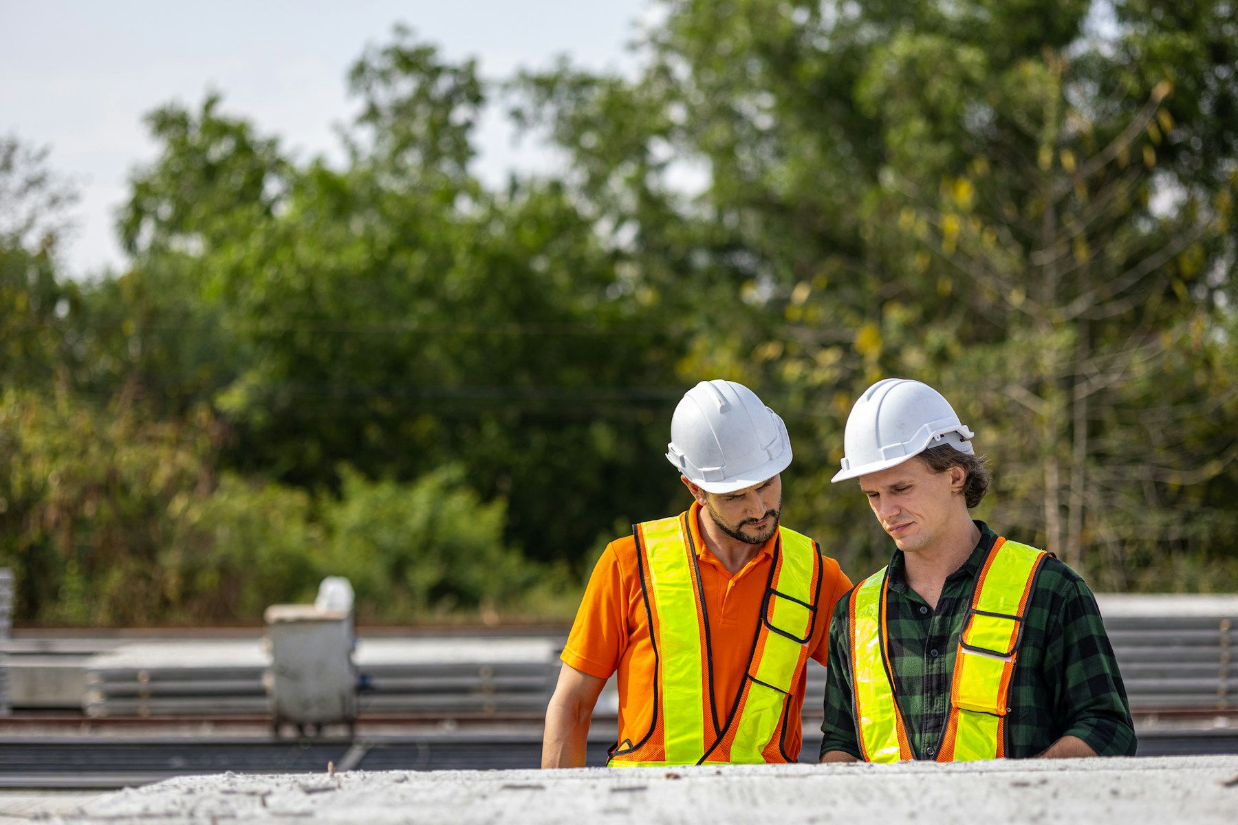 Construction professionals reviewing work together on a project site